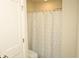 Bright bathroom with a shower featuring a stylish curtain at 1612 Fuma Leaf Way, Mcdonough, GA 30253