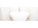 Close-up of a modern freestanding soaking tub with tile flooring at 1612 Fuma Leaf Way, Mcdonough, GA 30253