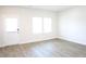 Bright, airy bedroom with wood-look floors at 1612 Fuma Leaf Way, Mcdonough, GA 30253