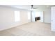 Spacious bedroom featuring neutral carpeting and a modern ceiling fan at 1612 Fuma Leaf Way, Mcdonough, GA 30253