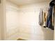Spacious walk-in closet with custom shelving and ample storage space for organization at 1612 Fuma Leaf Way, Mcdonough, GA 30253
