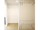 Bright closet space with wall-mounted shelving and carpeted floor at 1612 Fuma Leaf Way, Mcdonough, GA 30253