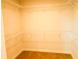 Walk-in closet featuring carpeted floors and wire shelving at 1612 Fuma Leaf Way, Mcdonough, GA 30253