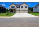 Charming two-story home with a three-car garage, and a well-maintained lawn at 1612 Fuma Leaf Way, Mcdonough, GA 30253