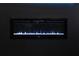 Close-up of a modern electric fireplace with blue and purple flame effects at 1612 Fuma Leaf Way, Mcdonough, GA 30253