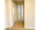 Upstairs hallway with carpet flooring and multiple doorways at 1612 Fuma Leaf Way, Mcdonough, GA 30253