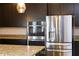 Kitchen with stainless steel appliances and granite countertops at 1612 Fuma Leaf Way, Mcdonough, GA 30253