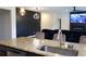 Open-concept kitchen flows into living area, featuring granite countertops and stainless appliances at 1612 Fuma Leaf Way, Mcdonough, GA 30253