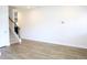 Open space featuring a stairway and wood-look flooring at 1612 Fuma Leaf Way, Mcdonough, GA 30253