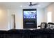 Cozy living room with entertainment center, a modern fireplace, and neutral decor at 1612 Fuma Leaf Way, Mcdonough, GA 30253