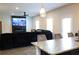 Open-concept kitchen flows into living area, featuring granite countertops and stainless appliances at 1612 Fuma Leaf Way, Mcdonough, GA 30253