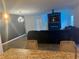 Stylish living room featuring modern lighting and a contemporary fireplace at 1612 Fuma Leaf Way, Mcdonough, GA 30253