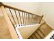 Carpeted staircase with modern railing and natural light at 1612 Fuma Leaf Way, Mcdonough, GA 30253