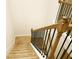Carpeted staircase with modern railing and natural light at 1612 Fuma Leaf Way, Mcdonough, GA 30253