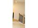 Upstairs hallway with carpet and natural wood railing at 1612 Fuma Leaf Way, Mcdonough, GA 30253