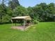 Outdoor pavilion with chairs offers a great space to relax and enjoy nature at 2323 Cedar Terrace Rd, Lithia Springs, GA 30122