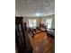 Spacious bedroom featuring hardwood floors, two windows, and a decorative ceiling light at 2323 Cedar Terrace Rd, Lithia Springs, GA 30122