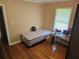 Bedroom with a twin bed, table, and light hardwood floors at 2323 Cedar Terrace Rd, Lithia Springs, GA 30122