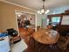 Cozy dining area with a traditional-style table, adjacent to the living room and kitchen at 2323 Cedar Terrace Rd, Lithia Springs, GA 30122