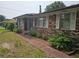 Exterior view of a brick home featuring nice landscaping at 2323 Cedar Terrace Rd, Lithia Springs, GA 30122