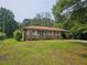 Charming single-story brick home with mature trees and landscaping at 2323 Cedar Terrace Rd, Lithia Springs, GA 30122