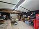 Bright shed interior with shelving units and a table at 2323 Cedar Terrace Rd, Lithia Springs, GA 30122