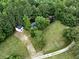 Aerial view of property with house, barn, and fenced pasture at 891 Wooten Ct, Canton, GA 30114