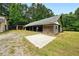 Image shows barn with large overhang and concrete slab at 891 Wooten Ct, Canton, GA 30114