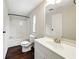 Neutral bathroom with a tub/shower, light vanity, and wood-look flooring at 891 Wooten Ct, Canton, GA 30114
