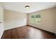 Bedroom with wood-look flooring, light walls and plenty of natural light from an exterior view at 891 Wooten Ct, Canton, GA 30114