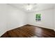 Comfortable bedroom with hardwood flooring and natural light streaming through a window at 891 Wooten Ct, Canton, GA 30114