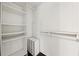 Walk-in closet with custom shelving and rack space at 891 Wooten Ct, Canton, GA 30114