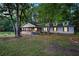 Charming home with a welcoming porch and well-manicured lawn at 891 Wooten Ct, Canton, GA 30114
