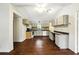 Open kitchen showcasing ample counter space, white appliances, and plenty of cabinet storage at 891 Wooten Ct, Canton, GA 30114