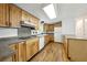 Bright kitchen with hardwood floors, light wood cabinets, and stainless-steel appliances at 891 Wooten Ct, Canton, GA 30114