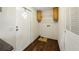 Functional laundry room with wooden cabinets and shelving providing ample storage at 891 Wooten Ct, Canton, GA 30114