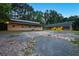 Multiple outbuildings with large gravel area, offering functional space at 891 Wooten Ct, Canton, GA 30114