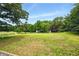 Picturesque property view with lush grass and mature trees at 891 Wooten Ct, Canton, GA 30114
