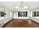 Bright sunroom featuring skylights, wood-look flooring, and large windows for natural light at 891 Wooten Ct, Canton, GA 30114