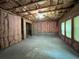 Unfinished basement awaiting customization, featuring insulation, exposed ceiling, and natural light through windows at 944 Reap Ln, Lawrenceville, GA 30043