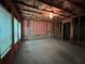 Unfinished basement awaiting customization, featuring insulation, exposed ceiling, and natural light through windows at 944 Reap Ln, Lawrenceville, GA 30043