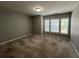 Well-lit bedroom offering natural light, a neutral paint and carpeting at 944 Reap Ln, Lawrenceville, GA 30043