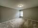 Neutral bedroom providing a calm and inviting space with a large window for natural light at 944 Reap Ln, Lawrenceville, GA 30043