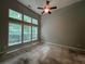 Bright bedroom with large windows offering ample natural light and a ceiling fan for added comfort at 944 Reap Ln, Lawrenceville, GA 30043