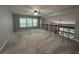 Spacious living room boasting natural light, neutral paint and a wrought iron railing at 944 Reap Ln, Lawrenceville, GA 30043