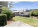 This backyard features a well-maintained lawn, a black fence, and an open patio space at 11686 Davenport Ln, Alpharetta, GA 30005