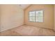 This comfortable bedroom features a window providing natural light at 11686 Davenport Ln, Alpharetta, GA 30005