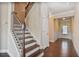 A home entryway with hard wood floors, stairs to the upper level, and white trim at 11686 Davenport Ln, Alpharetta, GA 30005