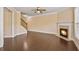 A large living room with a gas fireplace and hardwood floors at 11686 Davenport Ln, Alpharetta, GA 30005