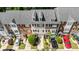 Aerial view of townhomes featuring well-maintained landscaping, garage parking, and diverse architectural details at 3068 Lauren Parc Rd, Decatur, GA 30032